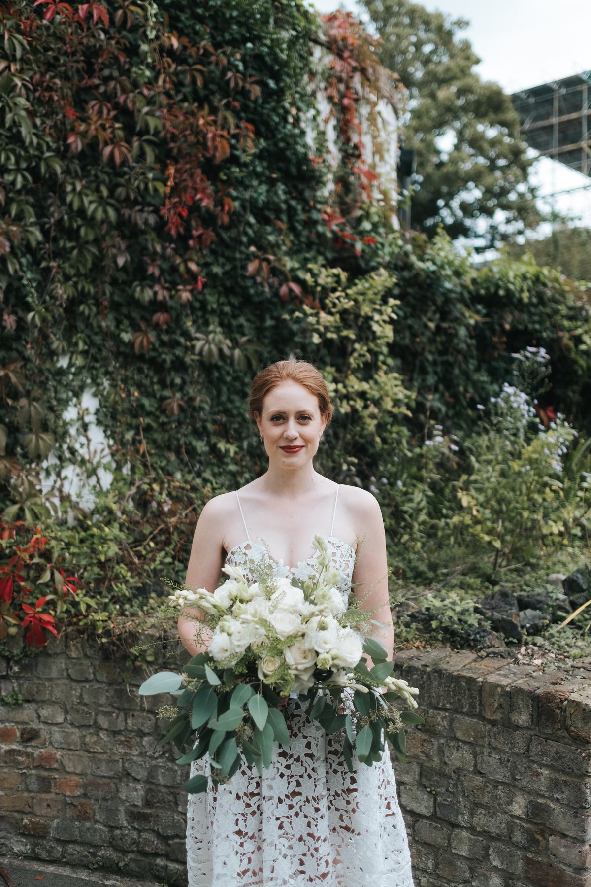Self portrait wedding dress and large wedding bouquet in greens and neutrals