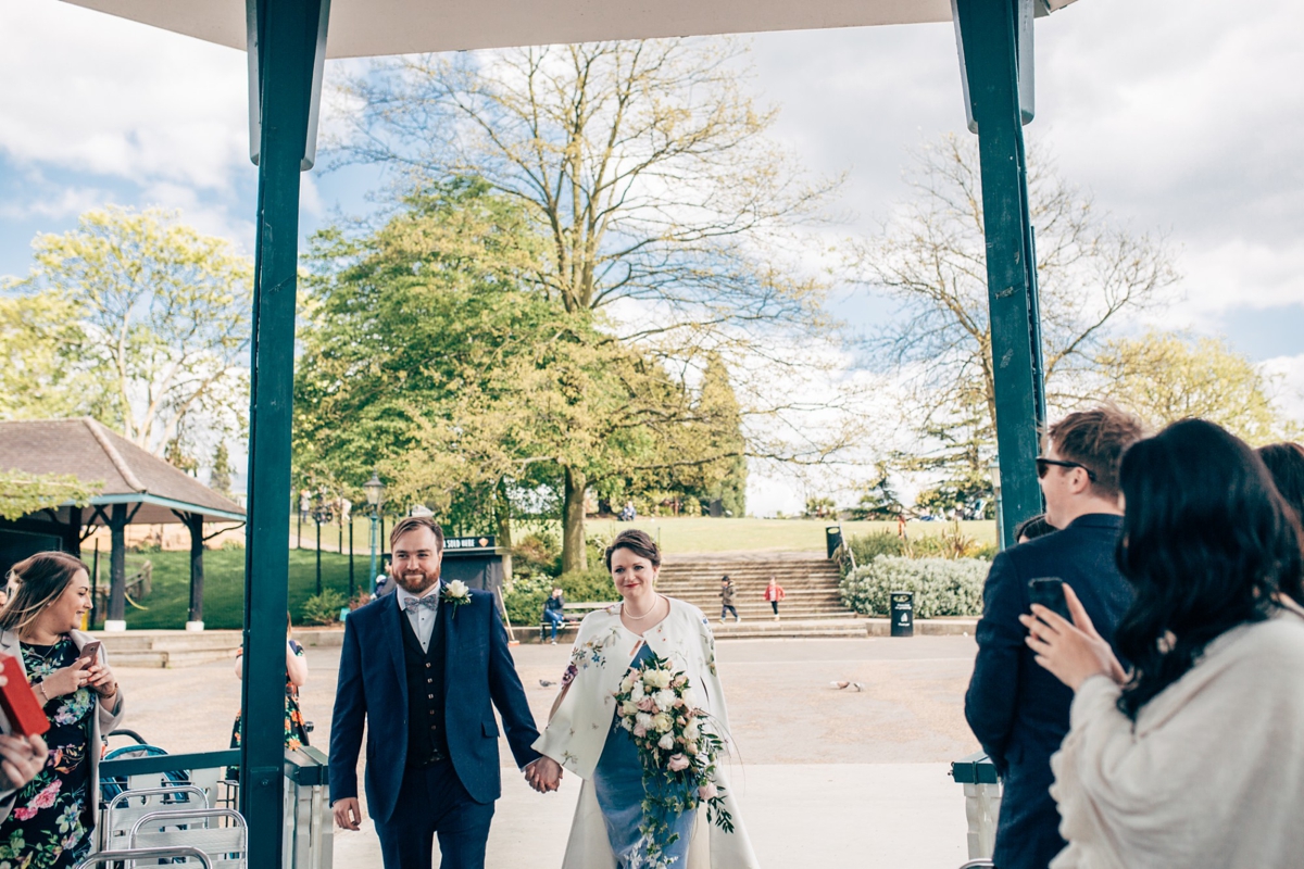 004 Bride and groom arriving together at bandstand wedding