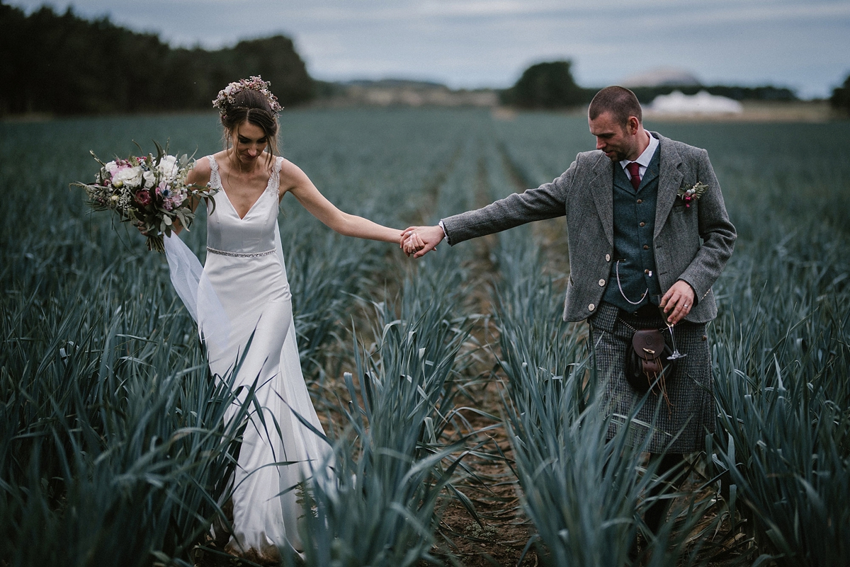 37 A Justin Alexander gown for a romantic outdoor wedding