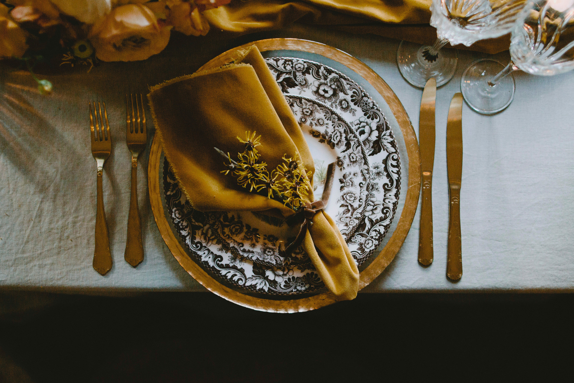 Gold napkin on blue china