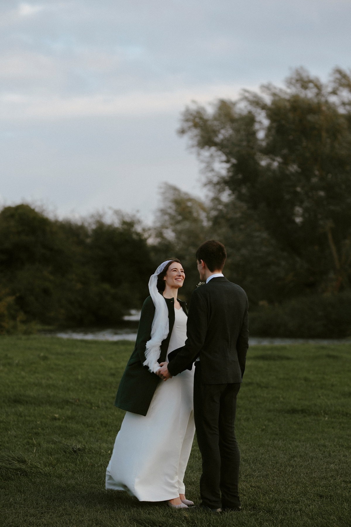 11 A bespoke long sleeved dress and vintage Whistles coat for an effotlessly elegant Cambridge wedding