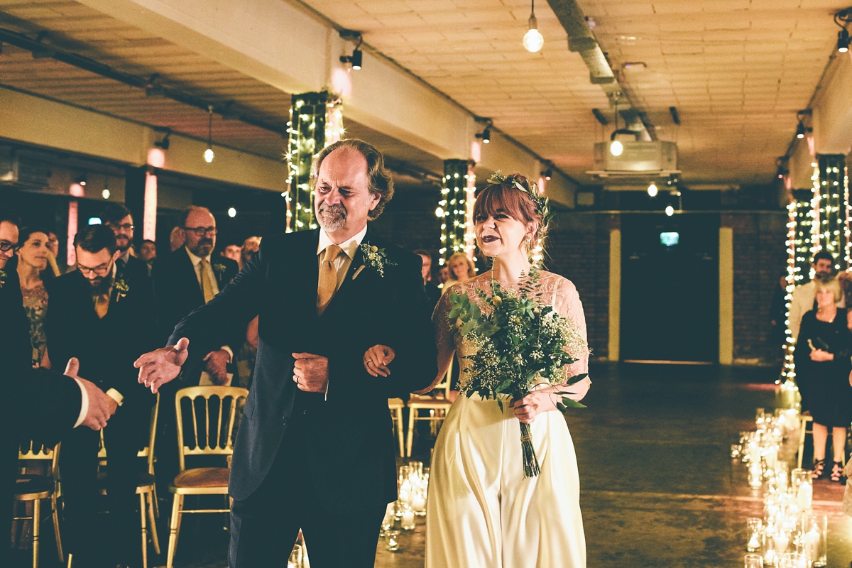 26 A bride in a selfmade jumpsuit for her industrial warehouse wedding in Manchester