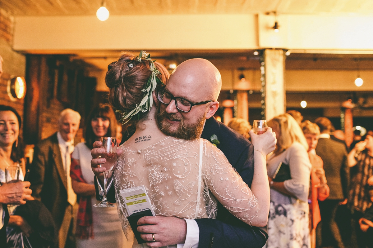 30 A bride in a selfmade jumpsuit for her industrial warehouse wedding in Manchester