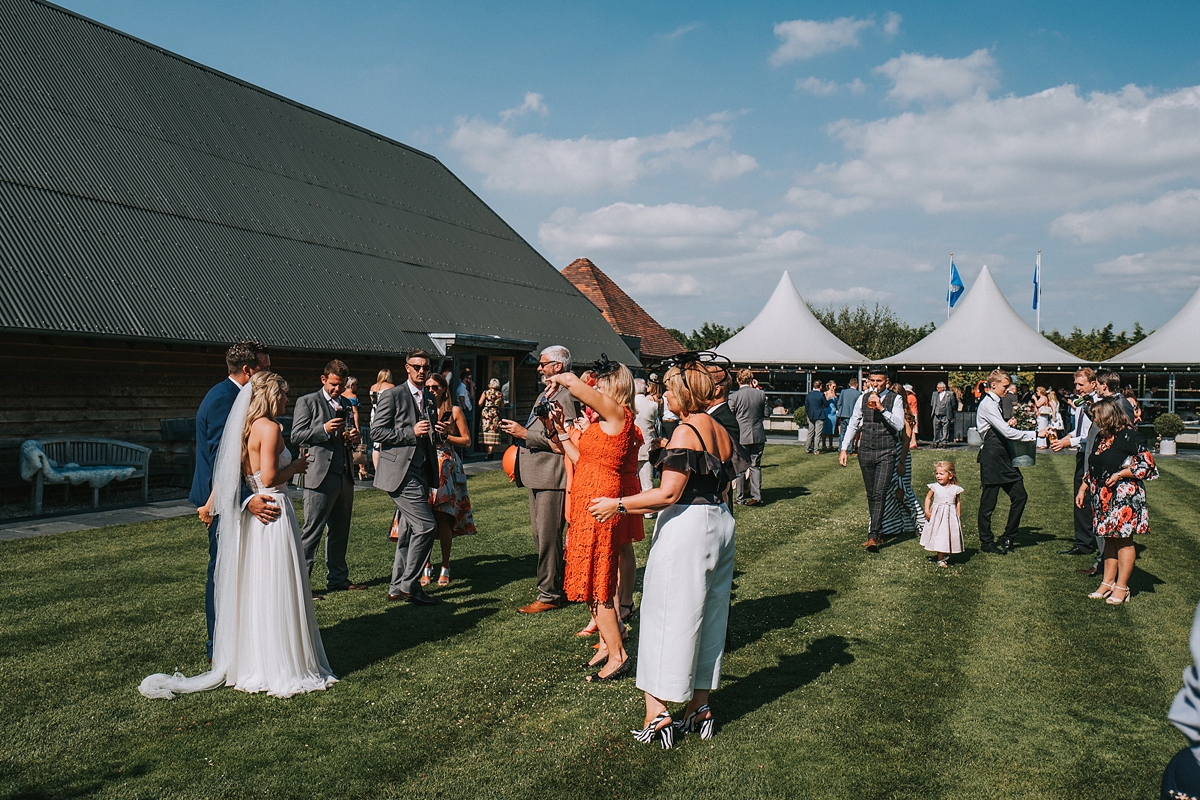 32 Paloma de Blanca dress copper peach and grey barn wedding