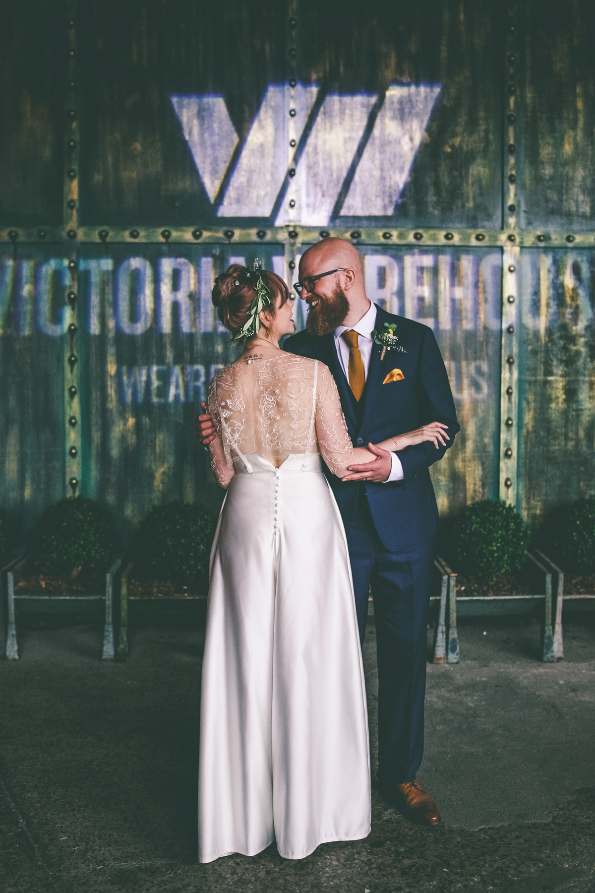 41 A bride in a selfmade jumpsuit for her industrial warehouse wedding in Manchester