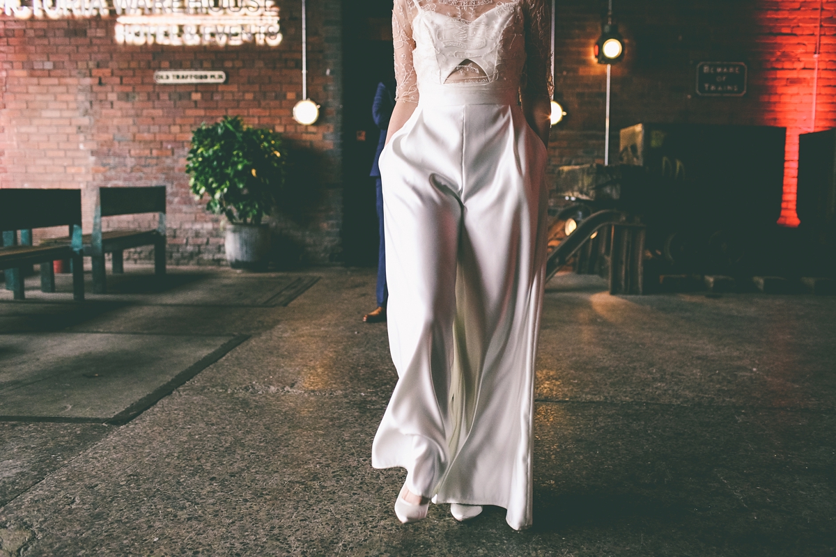 47 A bride in a selfmade jumpsuit for her industrial warehouse wedding in Manchester