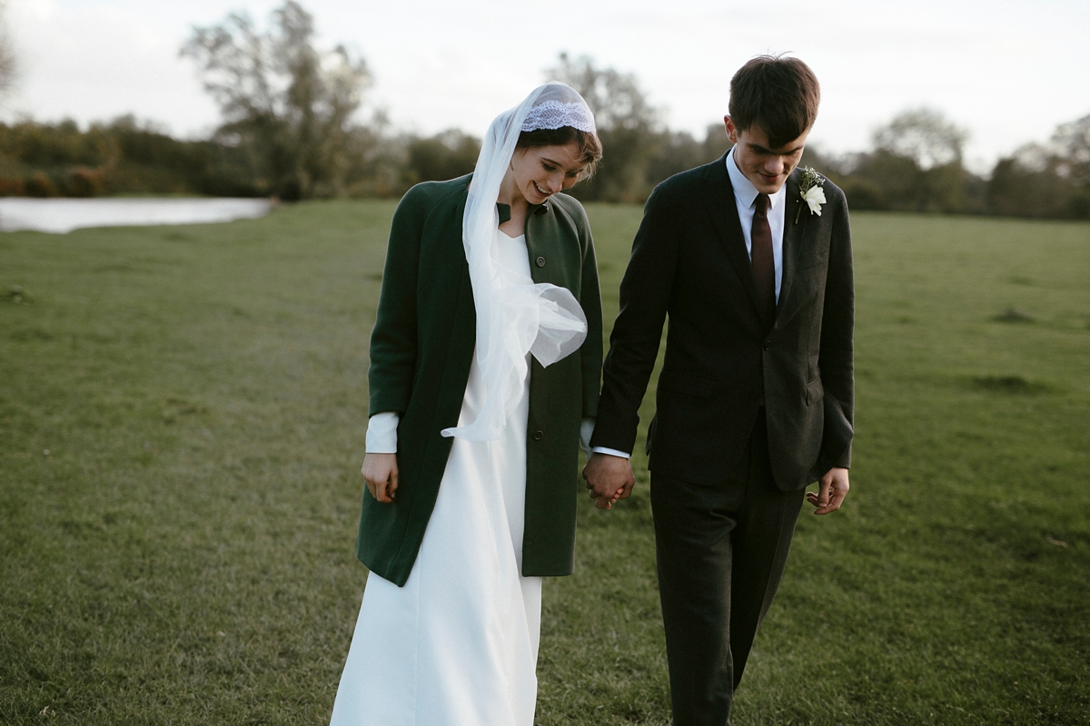 48 A bespoke long sleeved dress and vintage Whistles coat for an effotlessly elegant Cambridge wedding