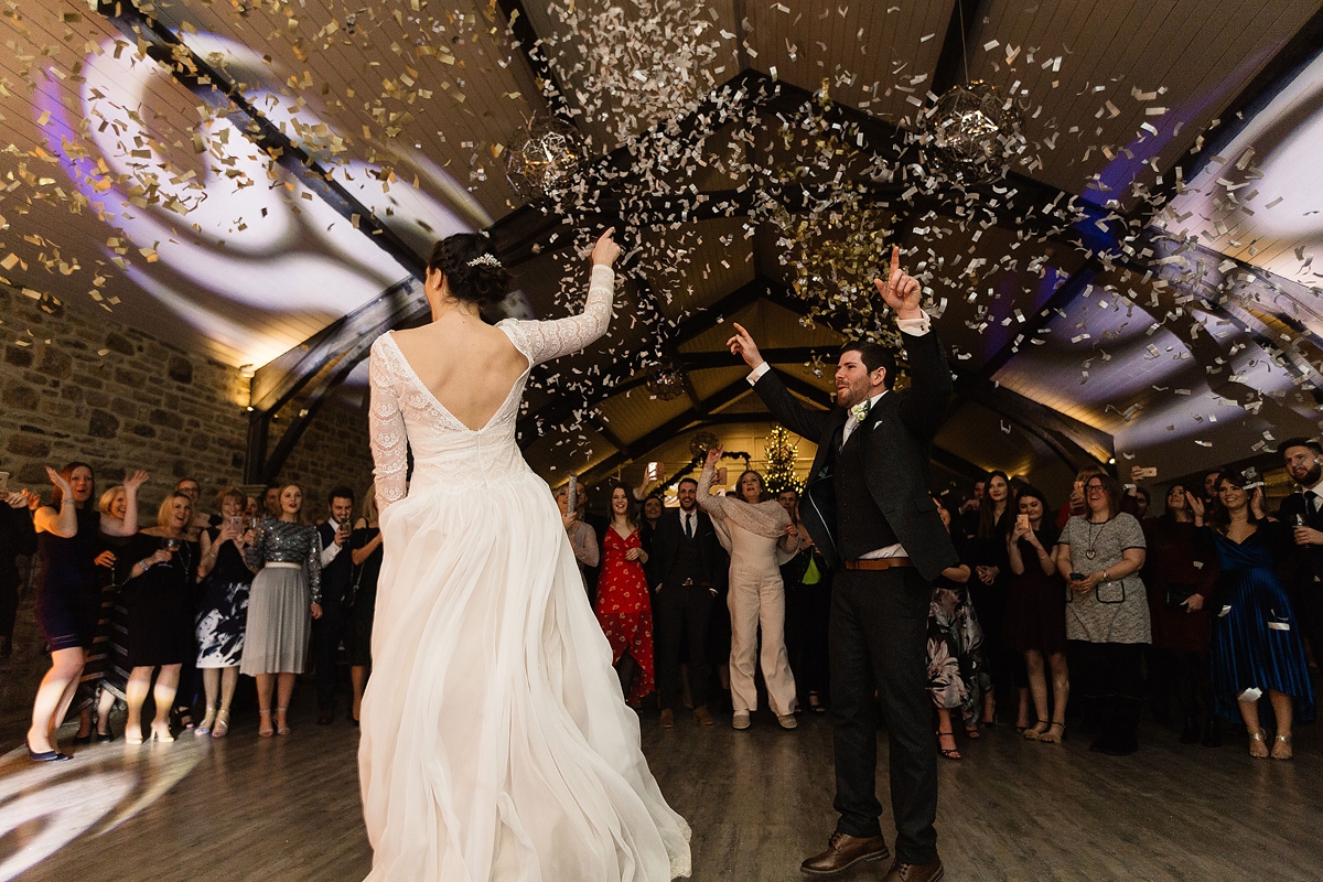 5 A Long sleeved Maggie Sottero dress for a candle lit winter barn wedding