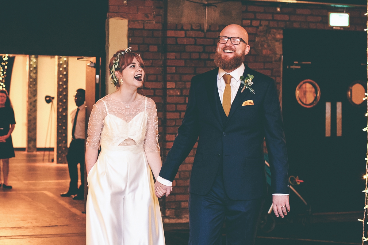 52 A bride in a selfmade jumpsuit for her industrial warehouse wedding in Manchester