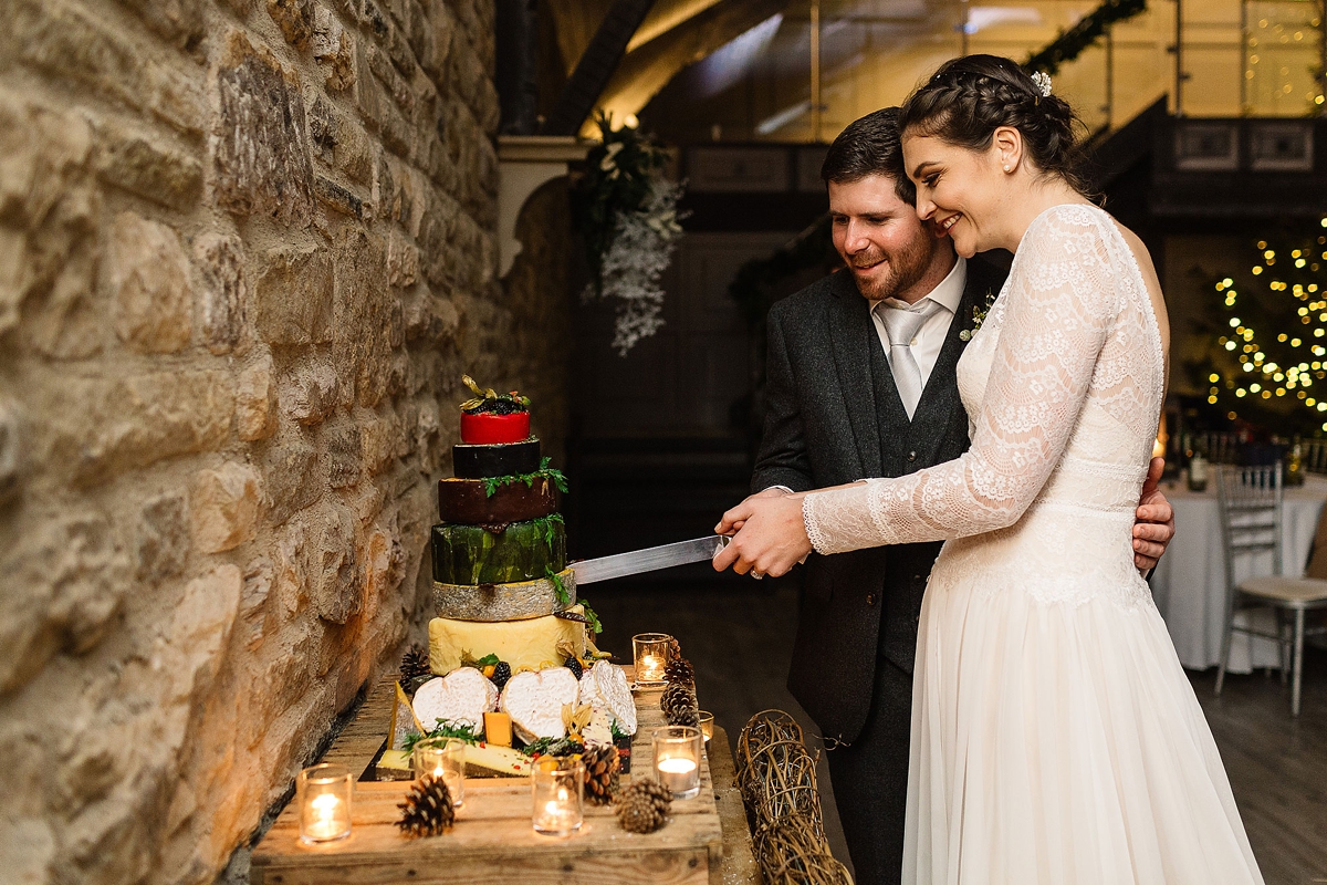 6 A Long sleeved Maggie Sottero dress for a candle lit winter barn wedding