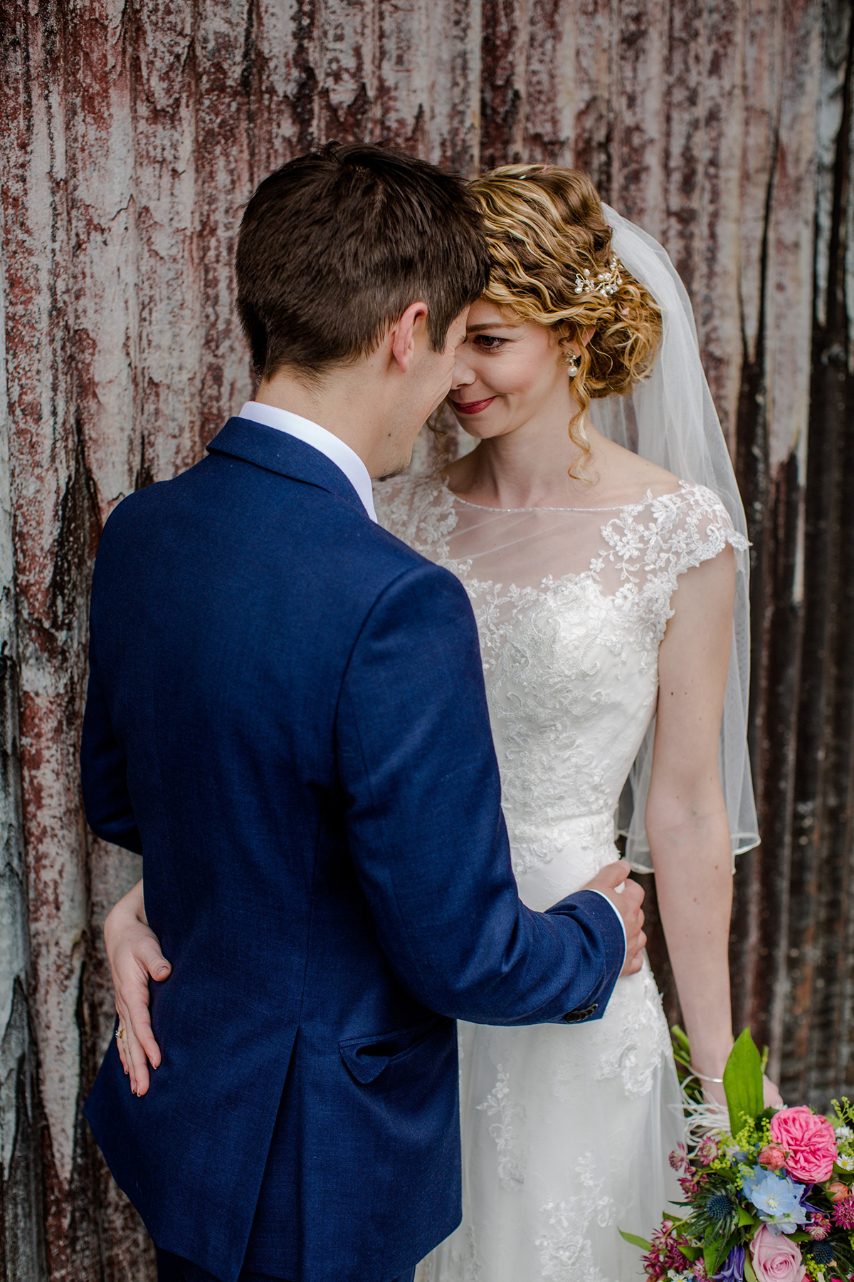 Ronald Joyce bride embracing husband