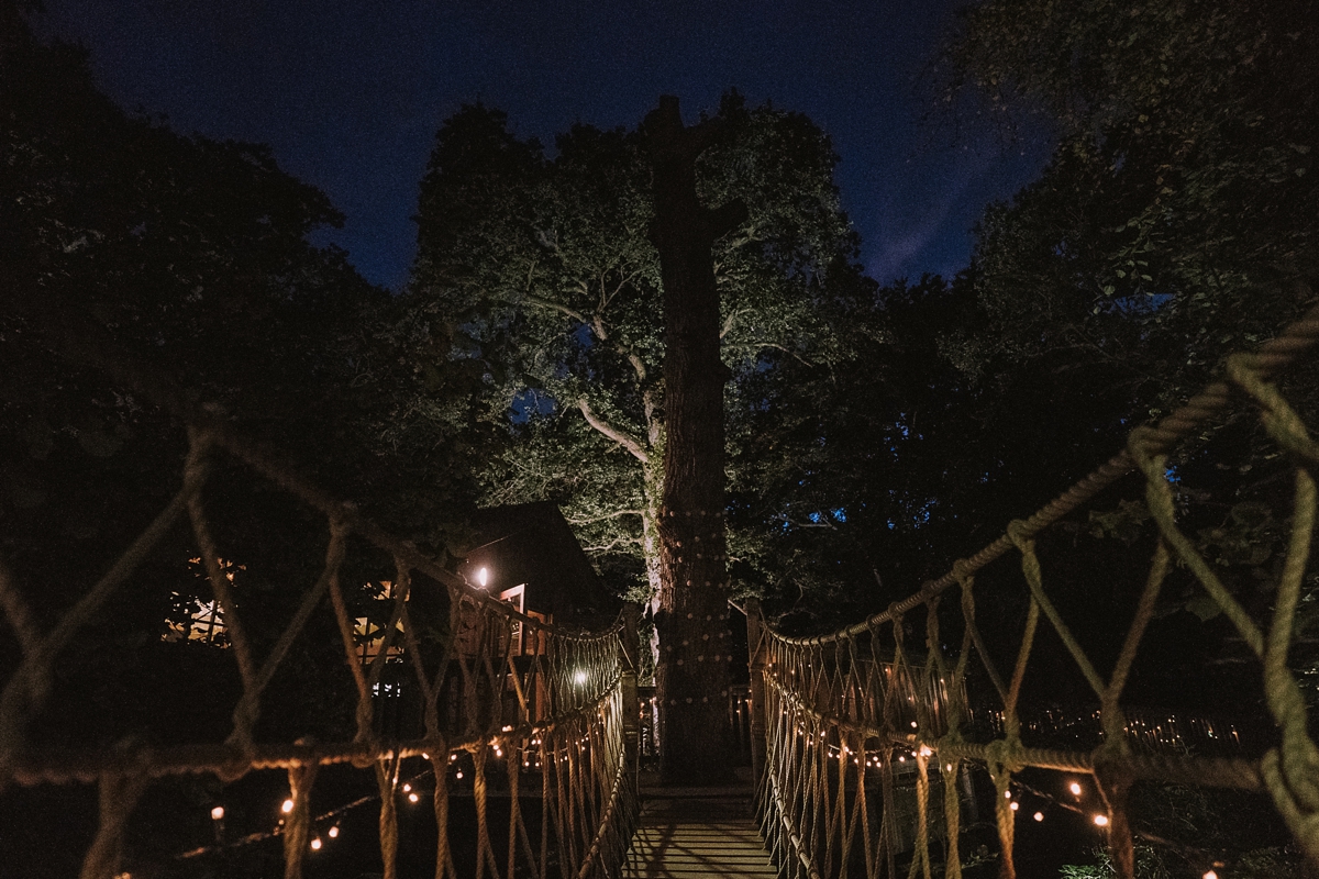 1 A bride wearing a Moonsoon dress for her treetop Autumn wedding