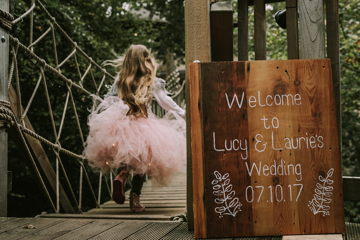 11 A bride wearing a Moonsoon dress for her treetop Autumn wedding