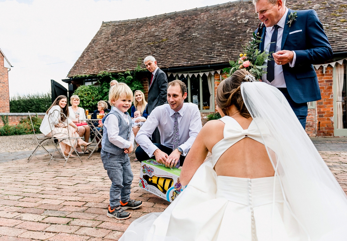 14 A Pronovias backless gownf or a simple relaxed barn wedding