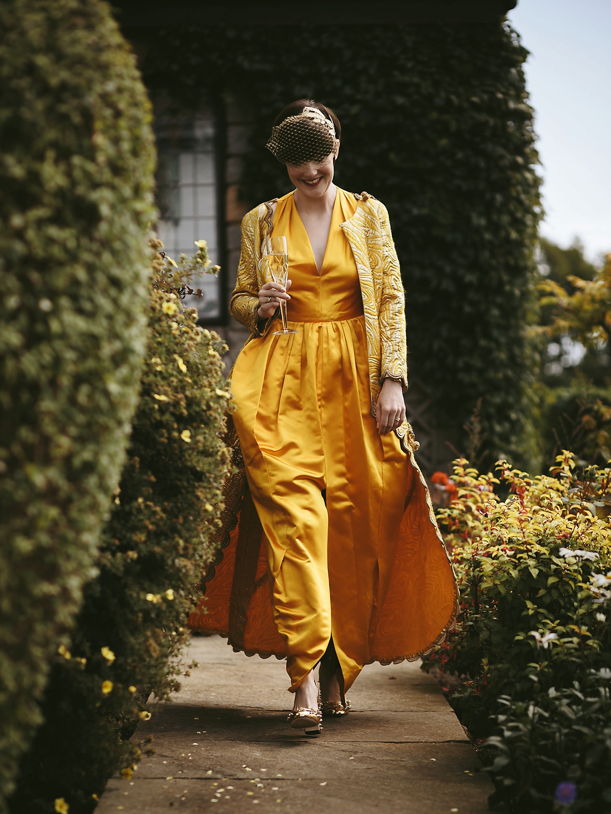 14 A yellow 1970s vintage Christian Dior gown and cape for a modern alternative Scottish wedding