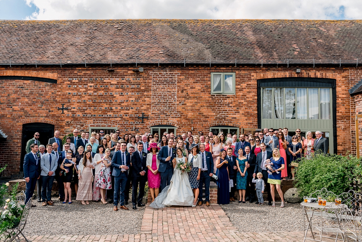 16 A Pronovias backless gownf or a simple relaxed barn wedding