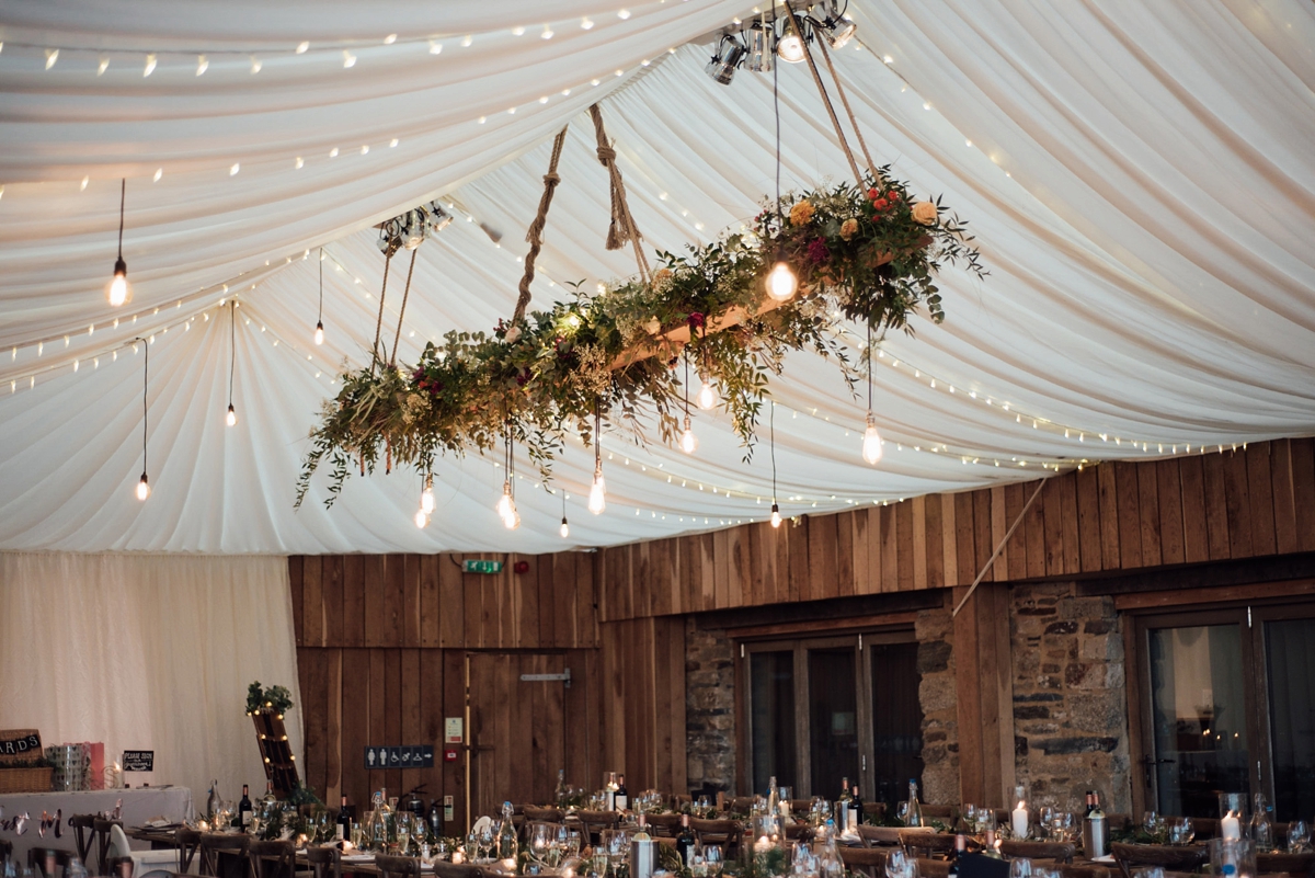 16 A Rembo Styling gown and leather jacket for a winter barn wedding in Cornwall