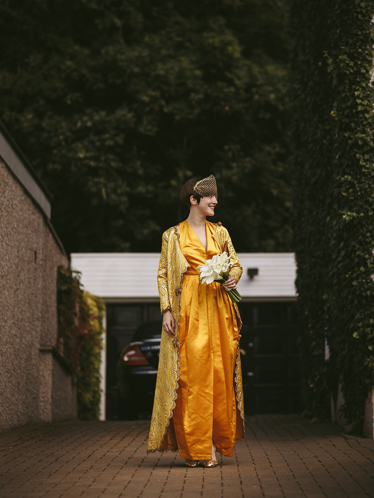 16 A yellow 1970s vintage Christian Dior gown and cape for a modern alternative Scottish wedding