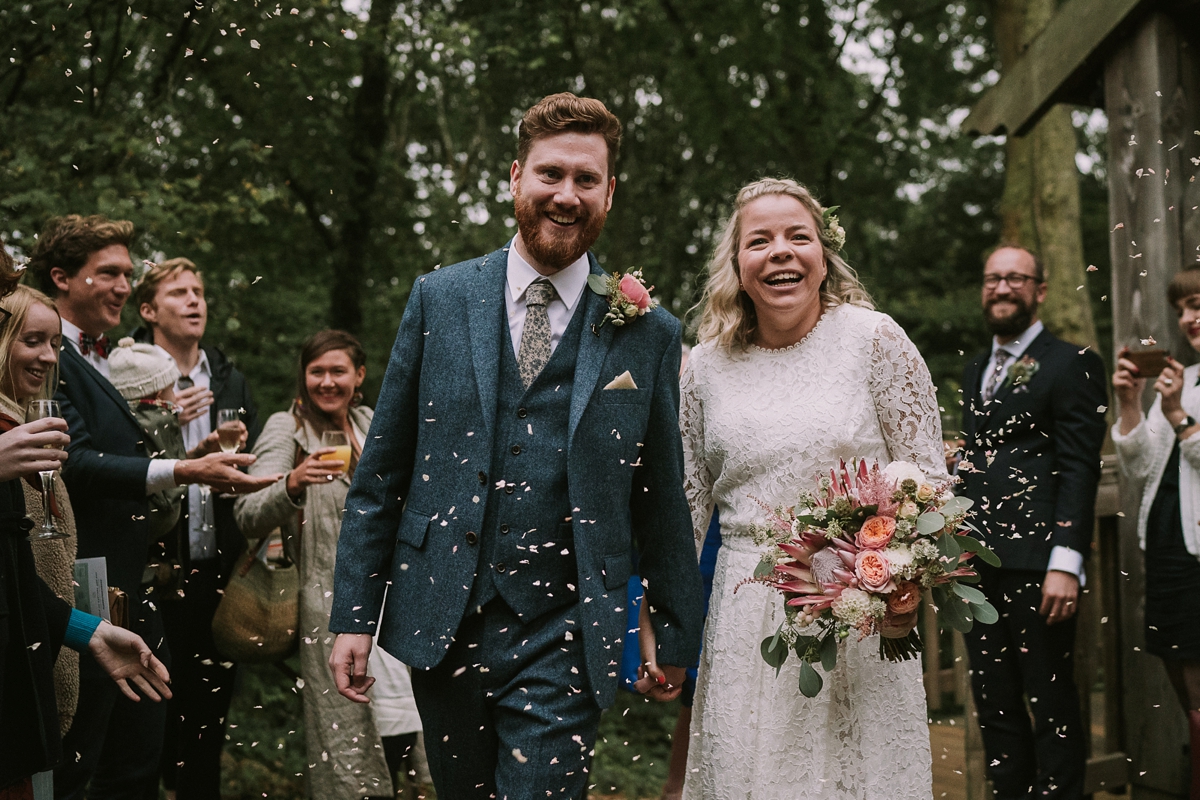 17 A bride wearing a Moonsoon dress for her treetop Autumn wedding