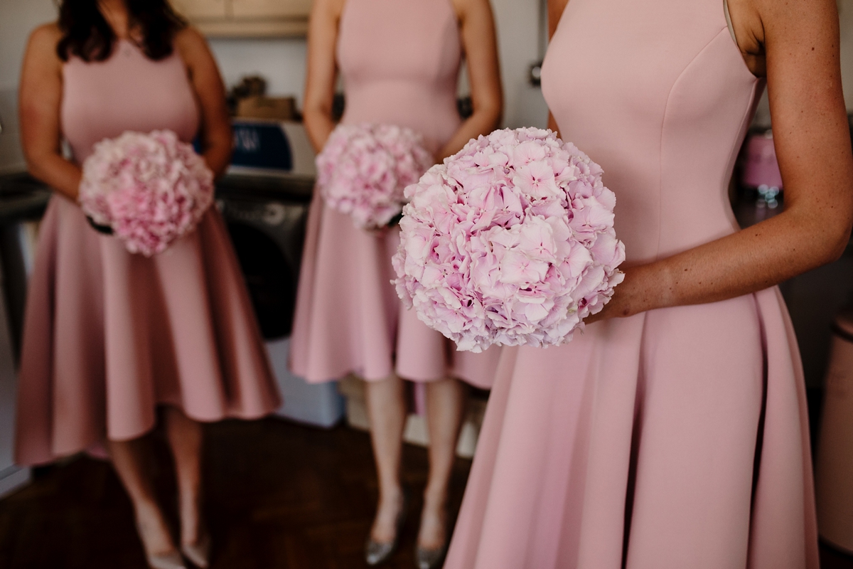 17 A pregnant bride wearing a feather cap sleeved Halfpenny London dress