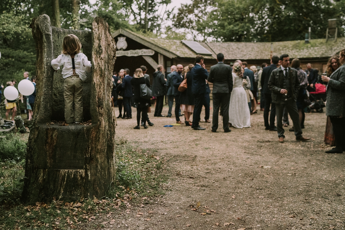 18 A bride wearing a Moonsoon dress for her treetop Autumn wedding