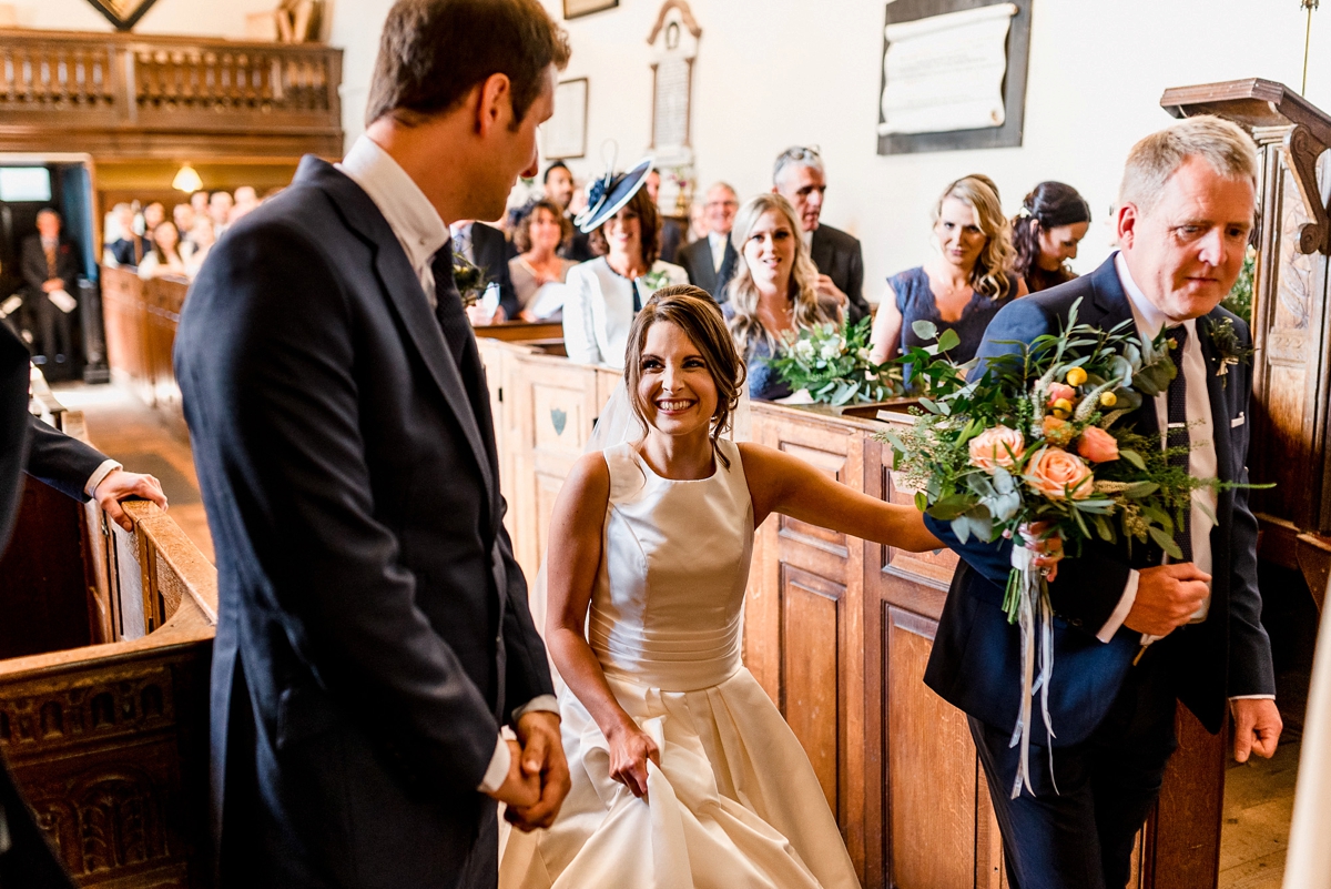 21 A Pronovias backless gownf or a simple relaxed barn wedding