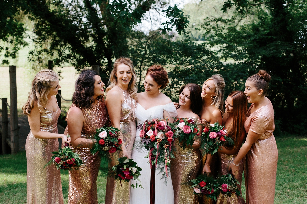 21 An Essense of Australia gown and bridesmaids in gold sequin gowns