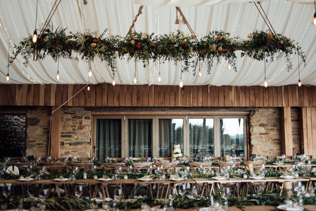 22 A Rembo Styling gown and leather jacket for a winter barn wedding in Cornwall