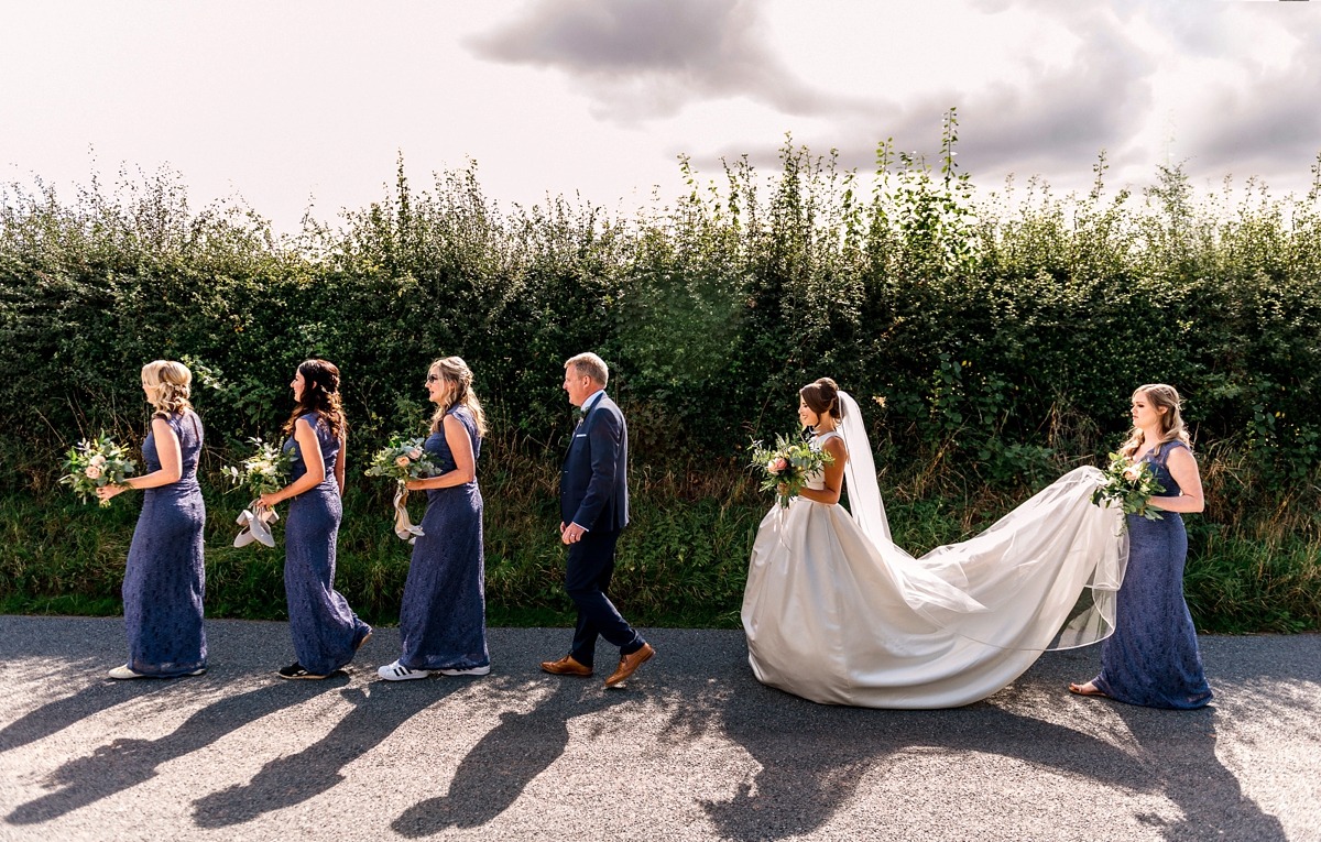 23 A Pronovias backless gownf or a simple relaxed barn wedding