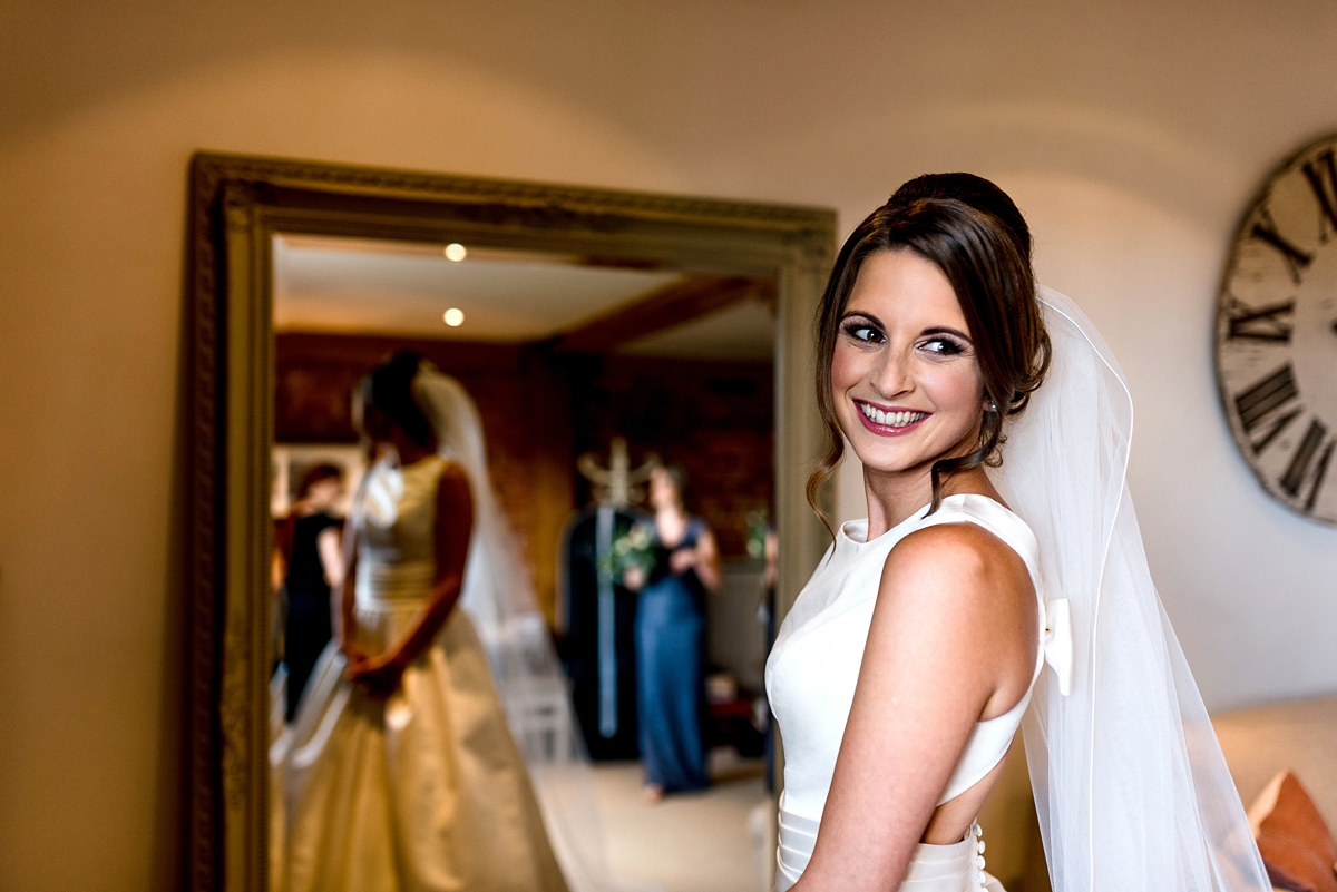 27 A Pronovias backless gownf or a simple relaxed barn wedding