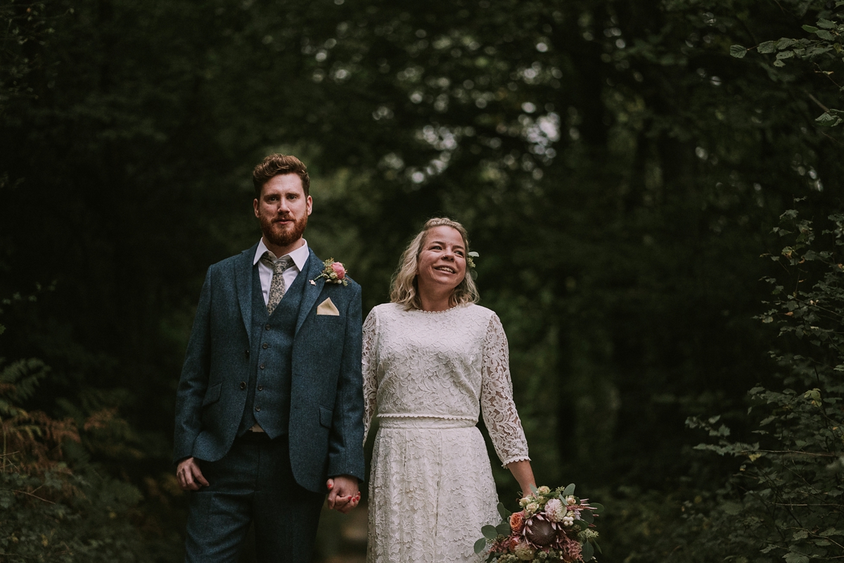 27 A bride wearing a Moonsoon dress for her treetop Autumn wedding