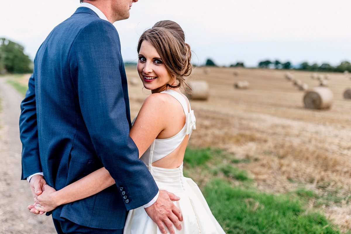 30 A Pronovias backless gownf or a simple relaxed barn wedding