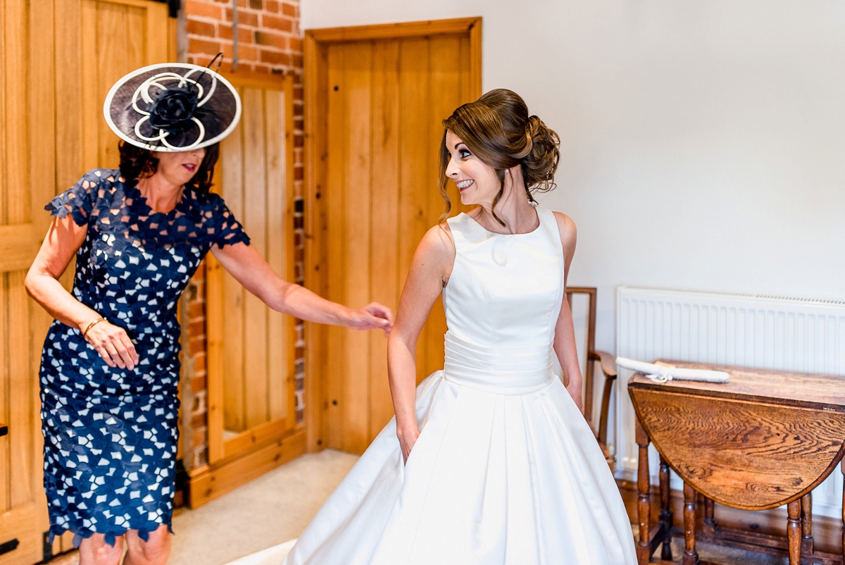 32 A Pronovias backless gownf or a simple relaxed barn wedding