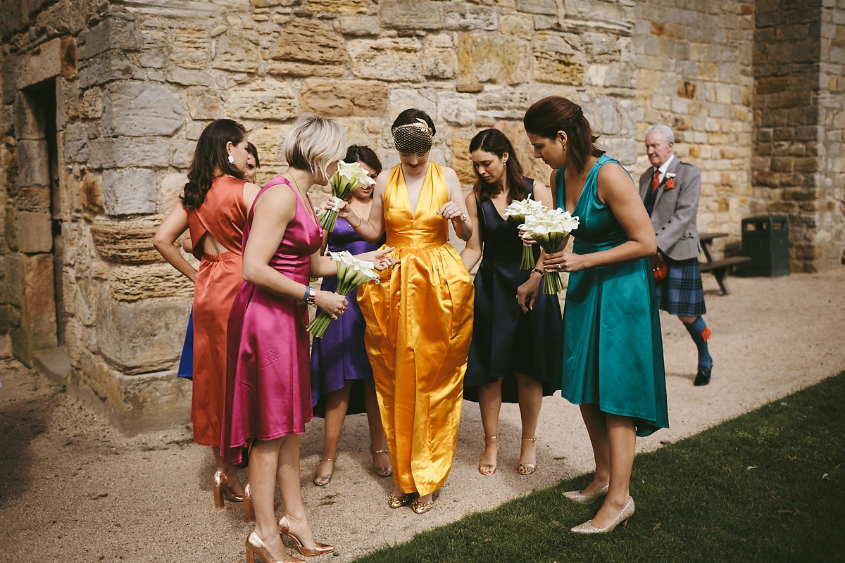 32 A yellow 1970s vintage Christian Dior gown and cape for a modern alternative Scottish wedding