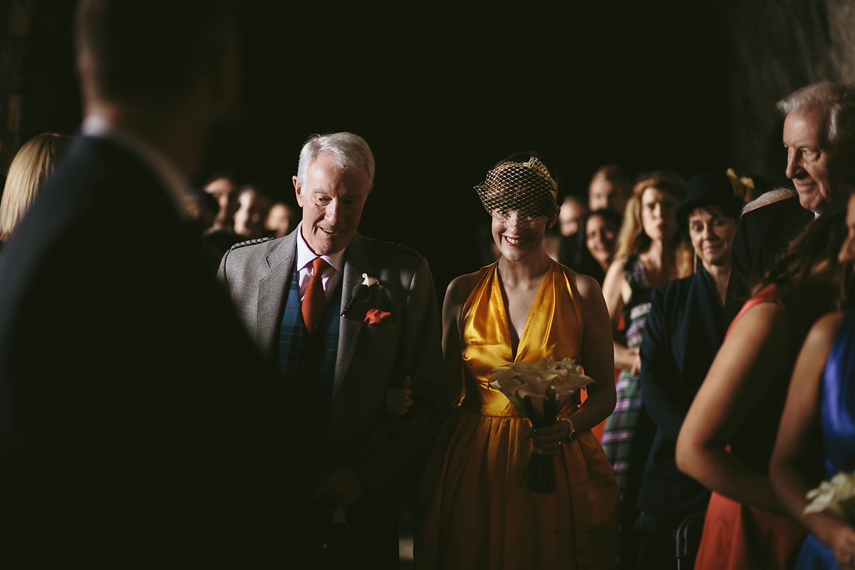 33 A yellow 1970s vintage Christian Dior gown and cape for a modern alternative Scottish wedding