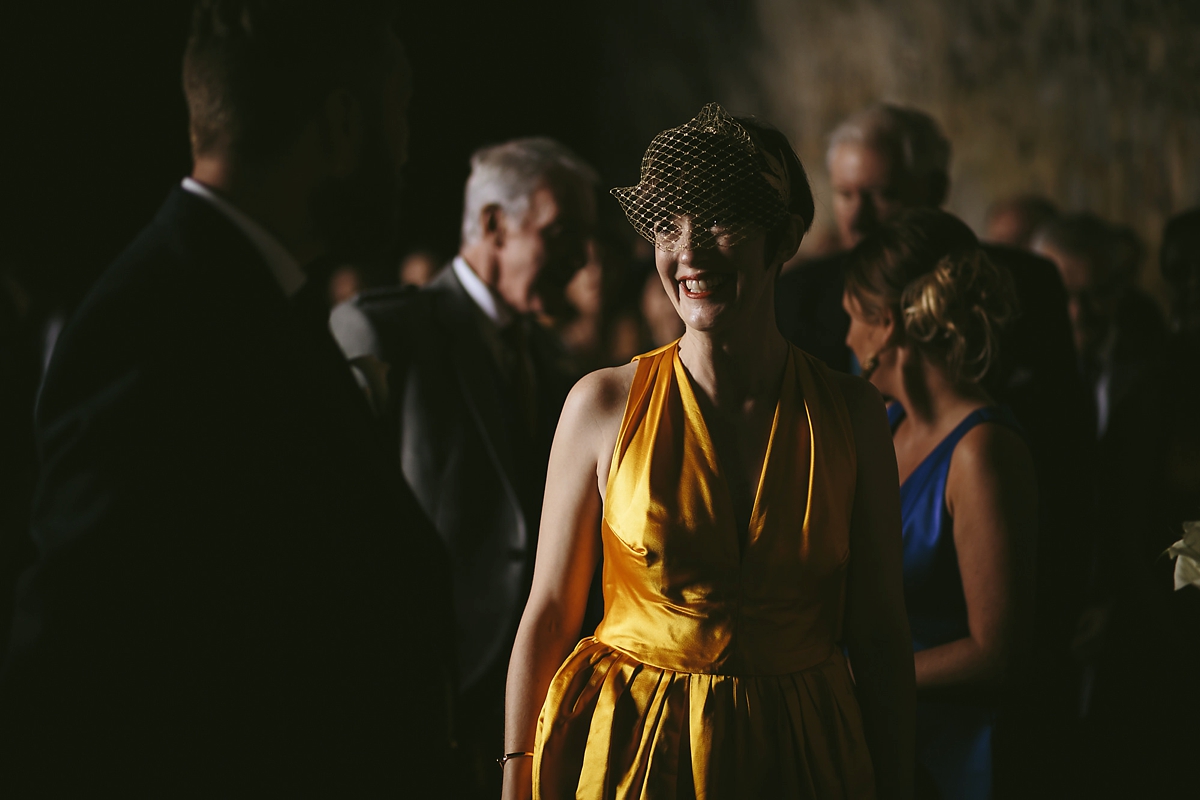 35 A yellow 1970s vintage Christian Dior gown and cape for a modern alternative Scottish wedding