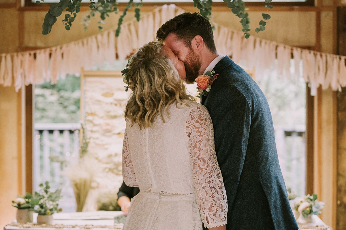 37 A bride wearing a Moonsoon dress for her treetop Autumn wedding