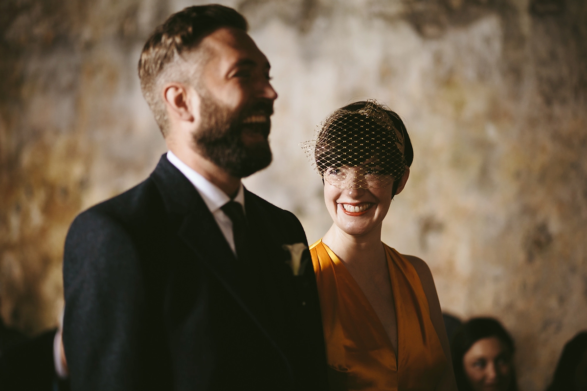 37 A yellow 1970s vintage Christian Dior gown and cape for a modern alternative Scottish wedding