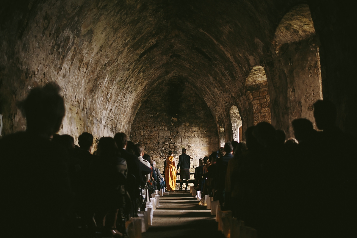 38 A yellow 1970s vintage Christian Dior gown and cape for a modern alternative Scottish wedding