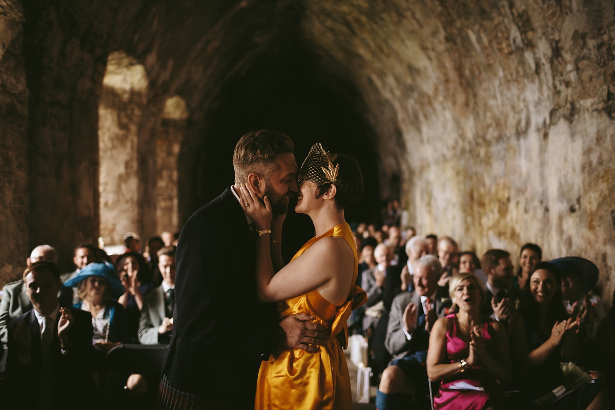 40 A yellow 1970s vintage Christian Dior gown and cape for a modern alternative Scottish wedding