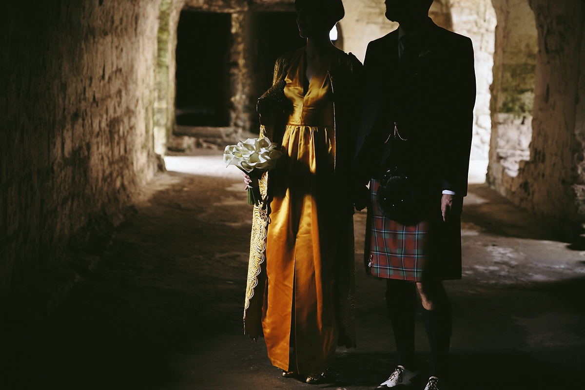 43 A yellow 1970s vintage Christian Dior gown and cape for a modern alternative Scottish wedding