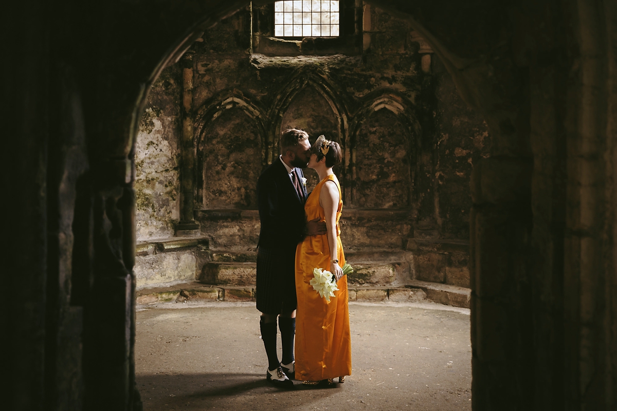 44 A yellow 1970s vintage Christian Dior gown and cape for a modern alternative Scottish wedding