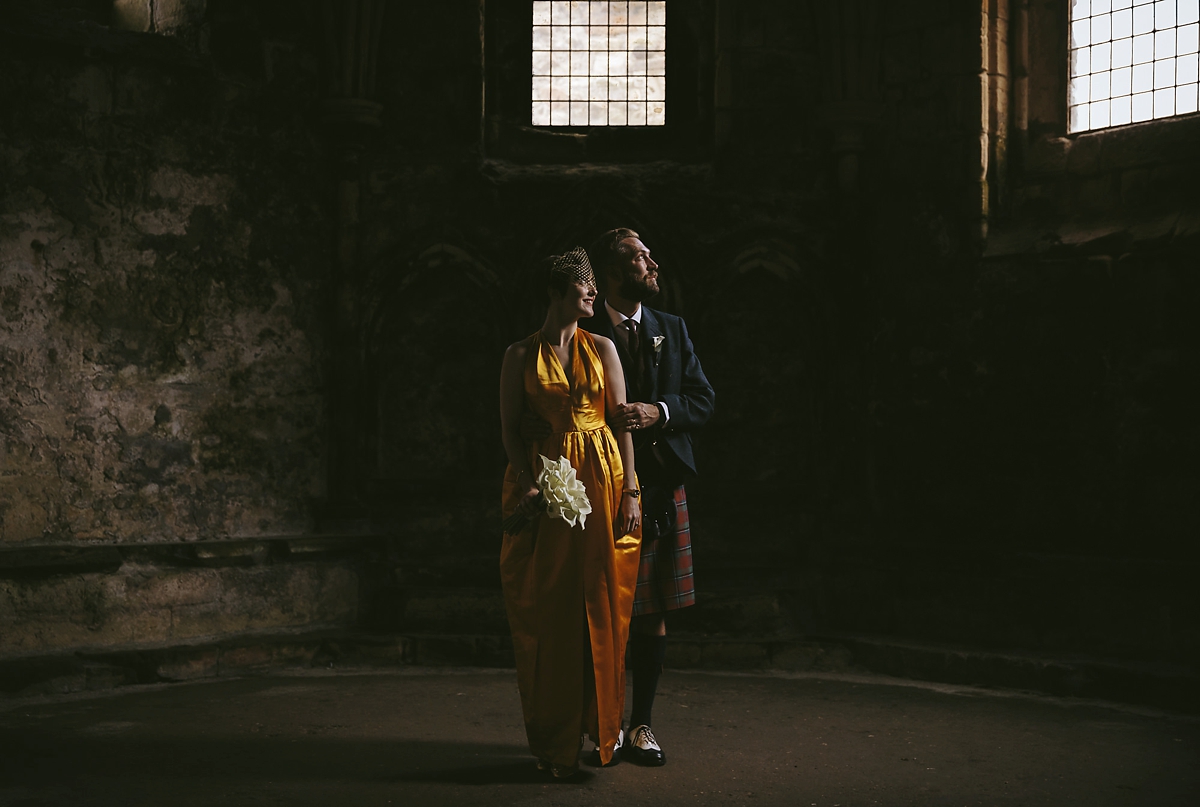 45 A yellow 1970s vintage Christian Dior gown and cape for a modern alternative Scottish wedding