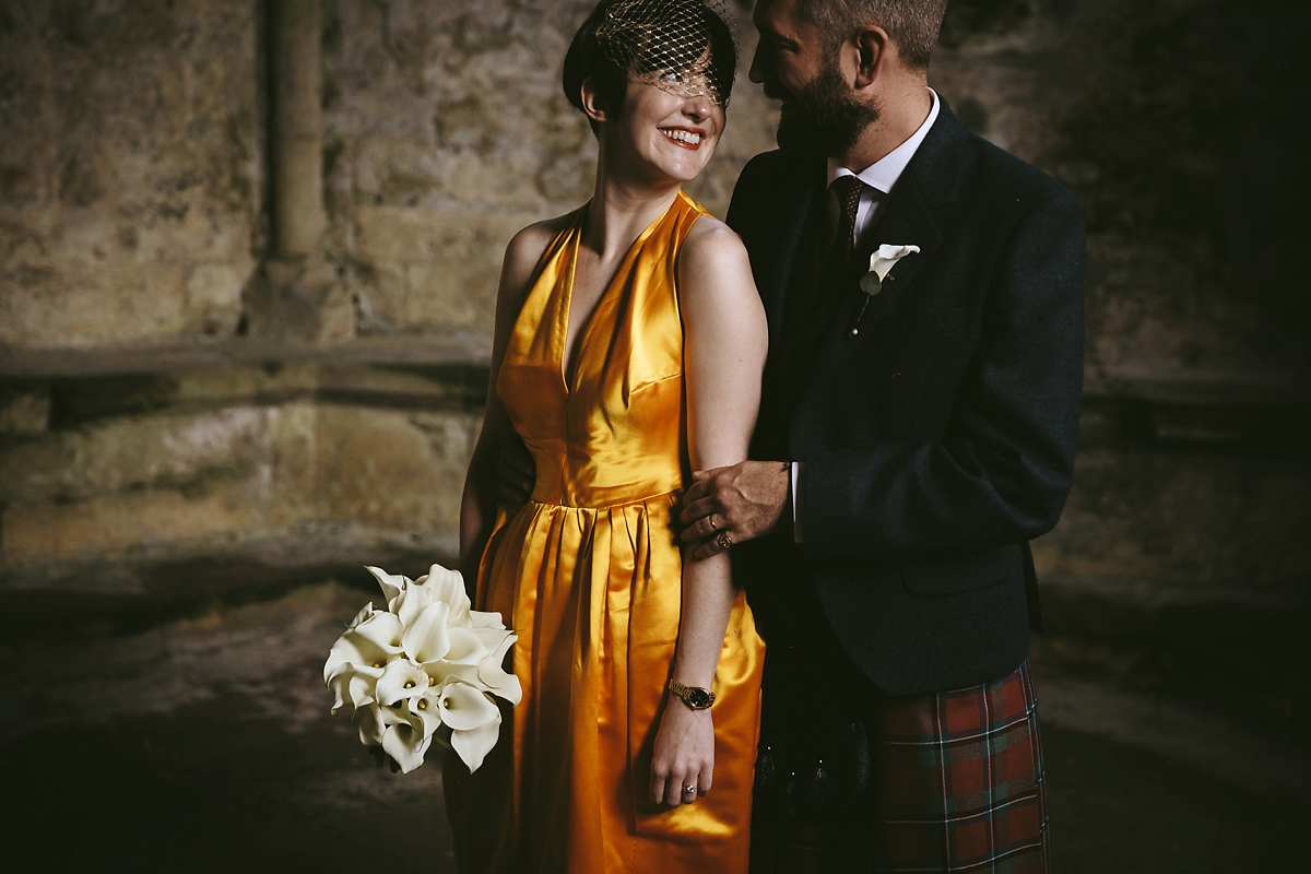 46 A yellow 1970s vintage Christian Dior gown and cape for a modern alternative Scottish wedding