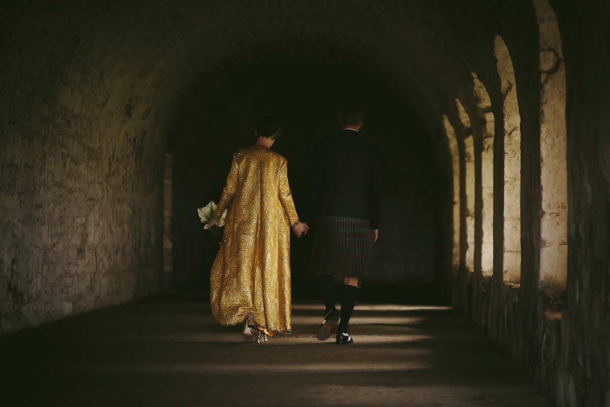 48 A yellow 1970s vintage Christian Dior gown and cape for a modern alternative Scottish wedding