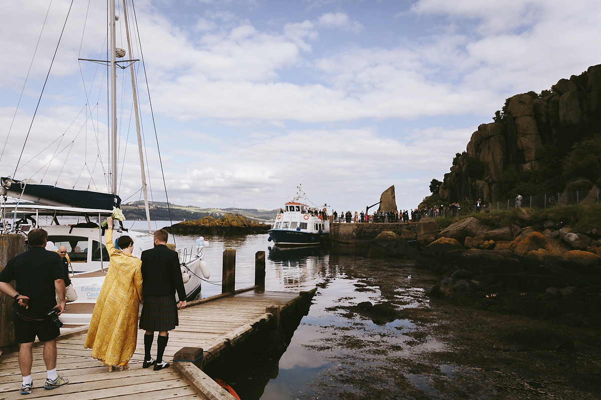 49 A yellow 1970s vintage Christian Dior gown and cape for a modern alternative Scottish wedding