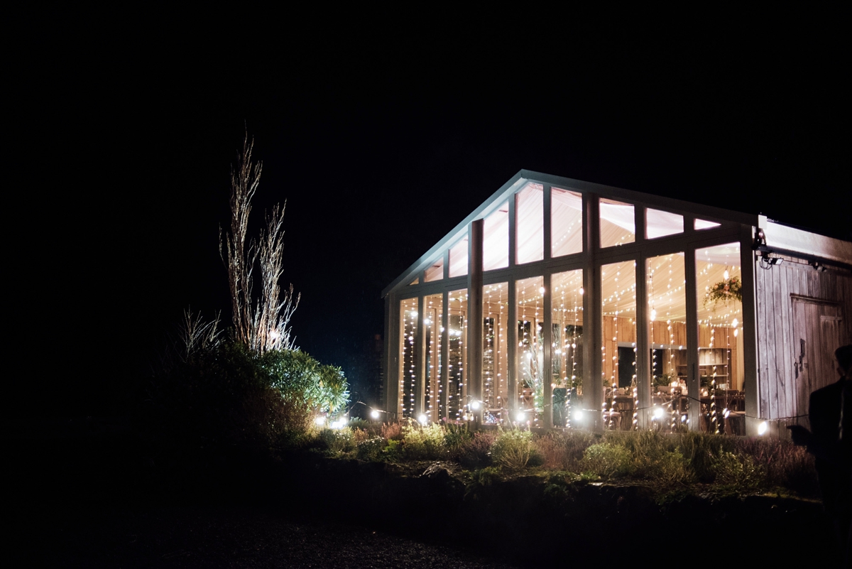 50 A Rembo Styling gown and leather jacket for a winter barn wedding in Cornwall