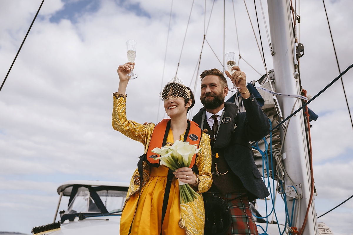 50 A yellow 1970s vintage Christian Dior gown and cape for a modern alternative Scottish wedding