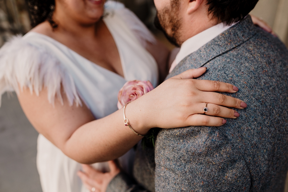 51 A pregnant bride wearing a feather cap sleeved Halfpenny London dress