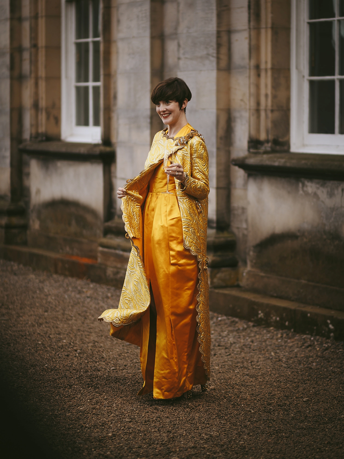 58 A yellow 1970s vintage Christian Dior gown and cape for a modern alternative Scottish wedding